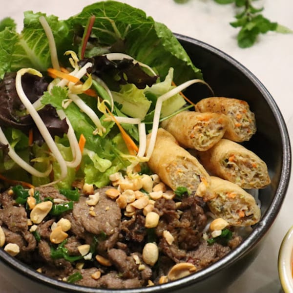 BaoBao Kitchen's Vietnamese vermicelli bowl with beef, crispy spring rolls, peanuts, and fresh vegetables.